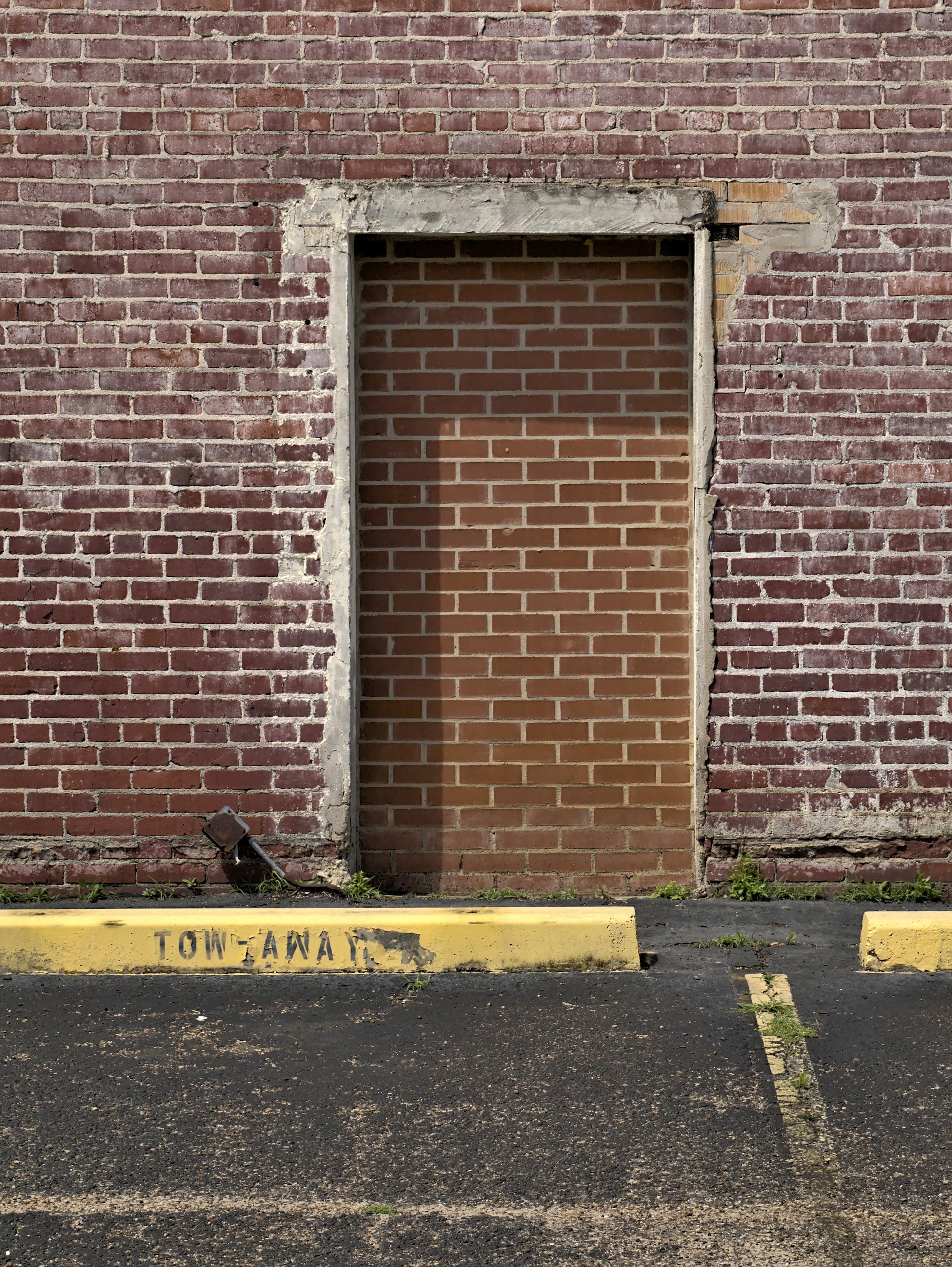 A brick wall with a brick door